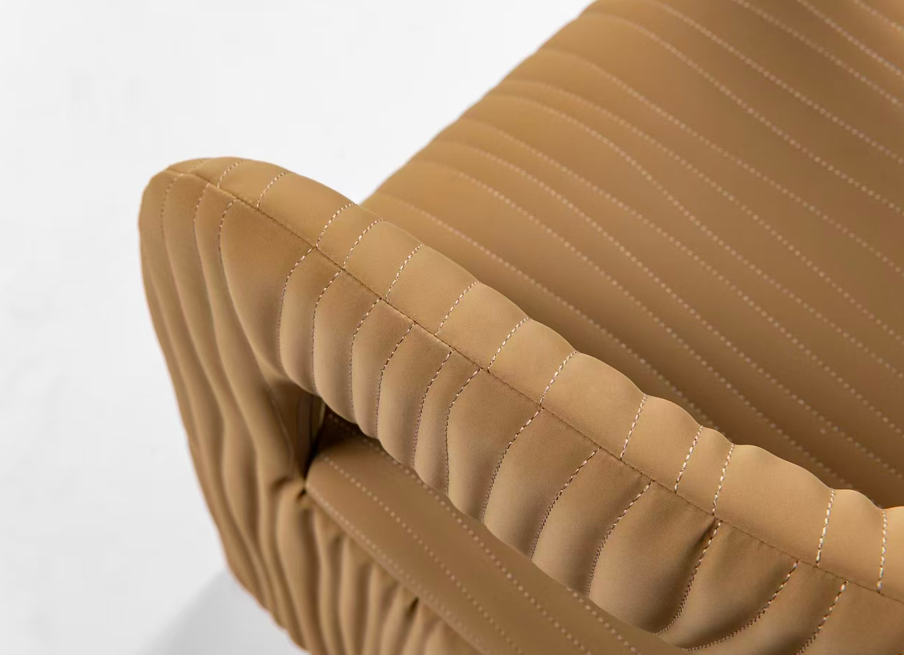 STANDEE HOME upholstery detail: tan stitched upholstery